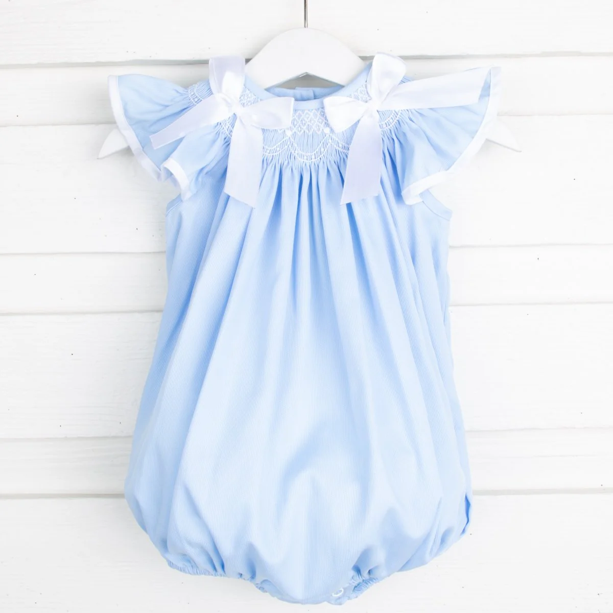 Geometric Smocked Ribbon Bow Bubble Blue Pique